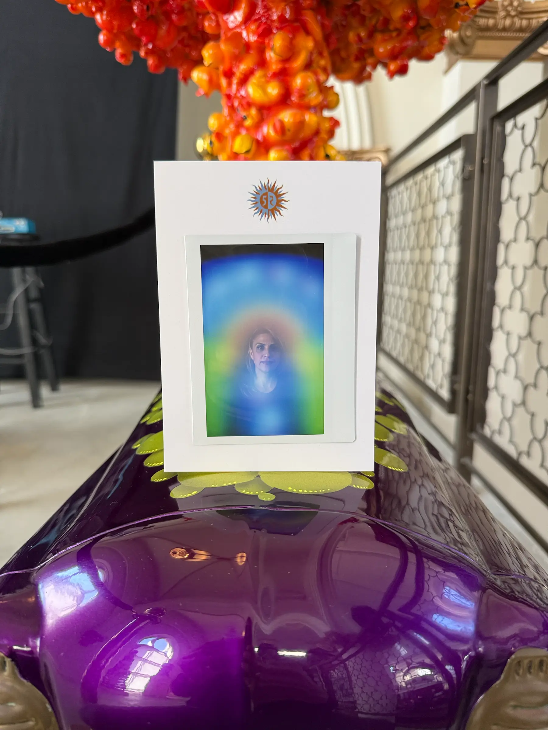 Framed aura portrait displayed at a live event activation