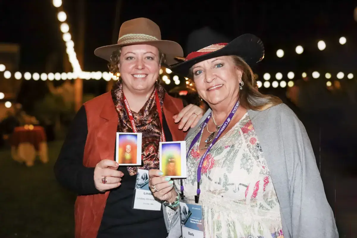 Attendees experiencing trade show aura photography at a California convention booth