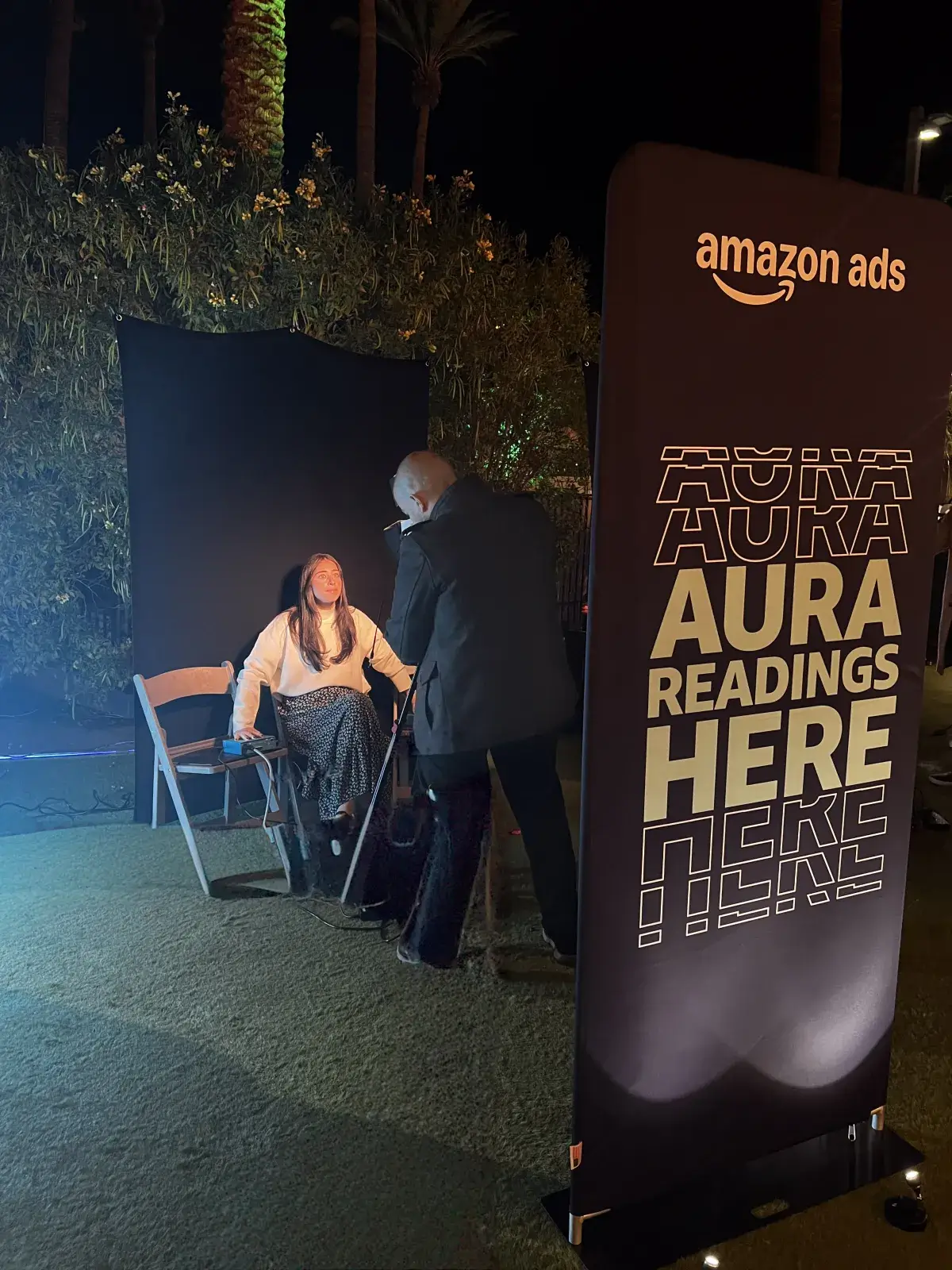 AuraCam 6000 biofeedback sensor session at a San Diego trade show booth