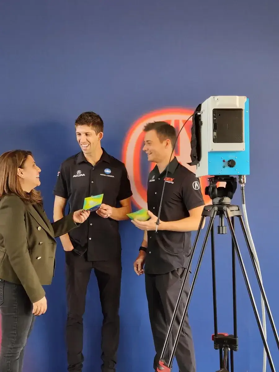 Attendees engaging with trade show aura photography at a San Francisco tech conference