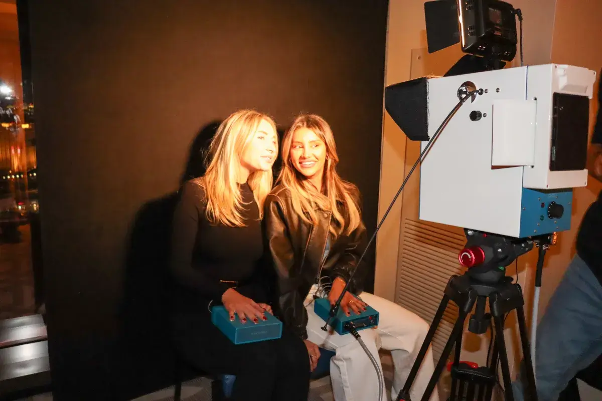 Wedding aura photography New York — guests experiencing biofeedback portraits at a Manhattan celebration