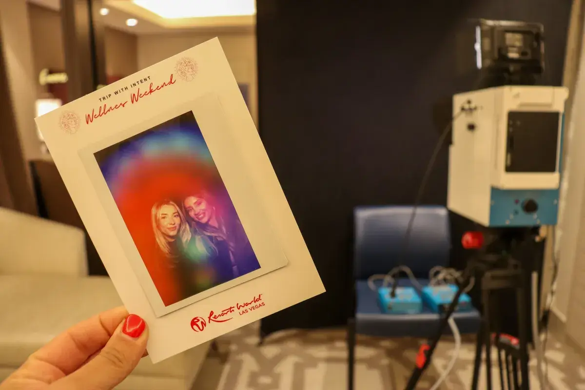 Guests exploring their aura portraits at a New York wedding reception
