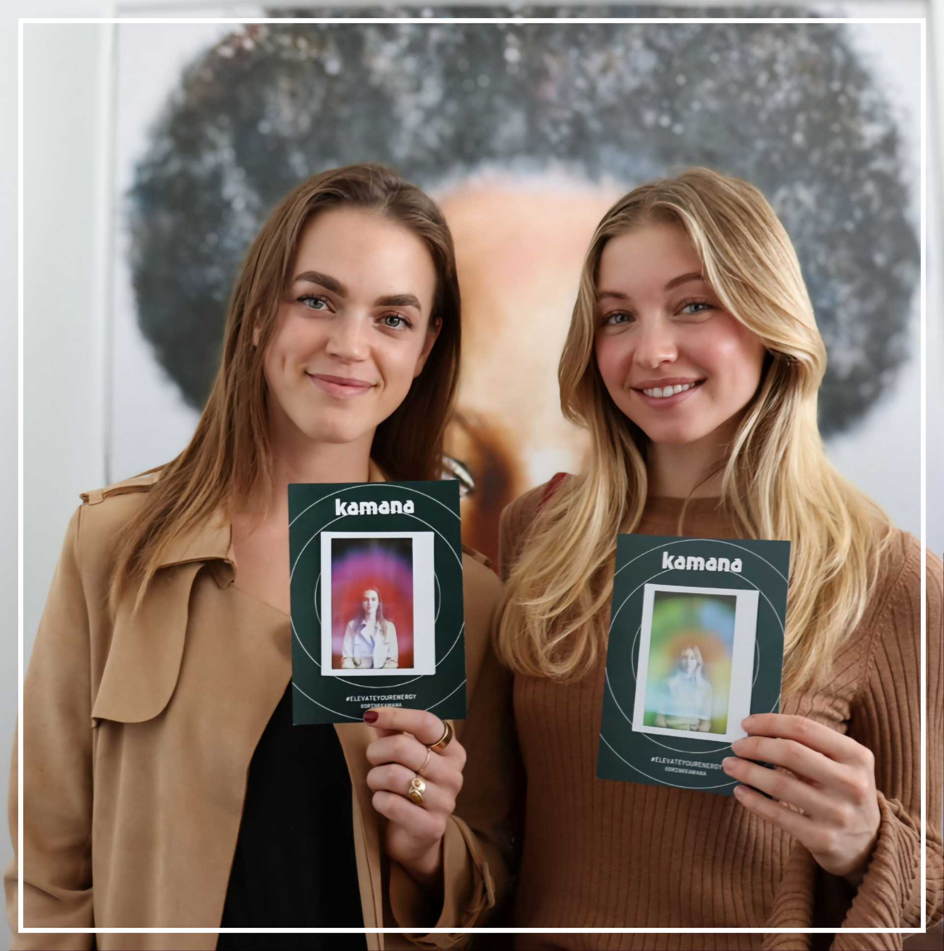 Two girls are holding Aura Photos in San Diego event